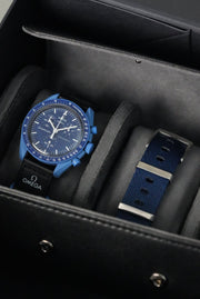 Blue watch with a strap in a black box