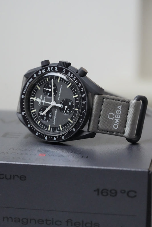 Omega watch with black strap on a white background