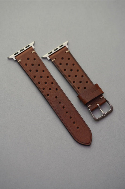 Full flat view of brown perforated leather strap for Apple Watch