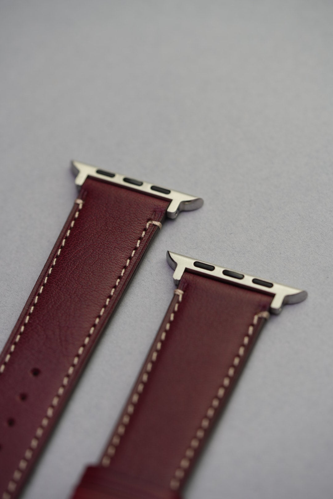 Burgundy Fine Grain Leather Strap with Apple Watch connectors and signature grain texture