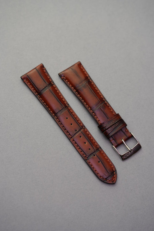 Burgundy calfskin strap with embossed alligator pattern – lightly padded, luxury grain detail