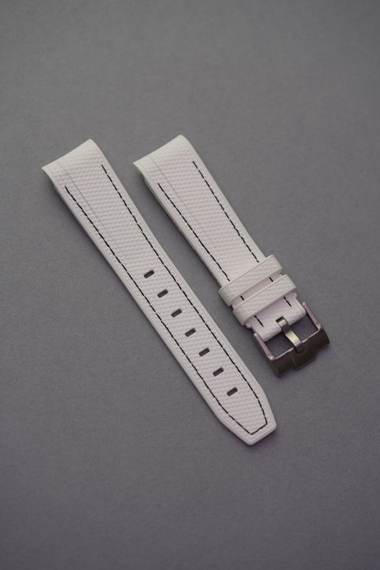 Curved-end white rubber woven strap with bold black stitching, designed to fit MoonSwatch watches.
