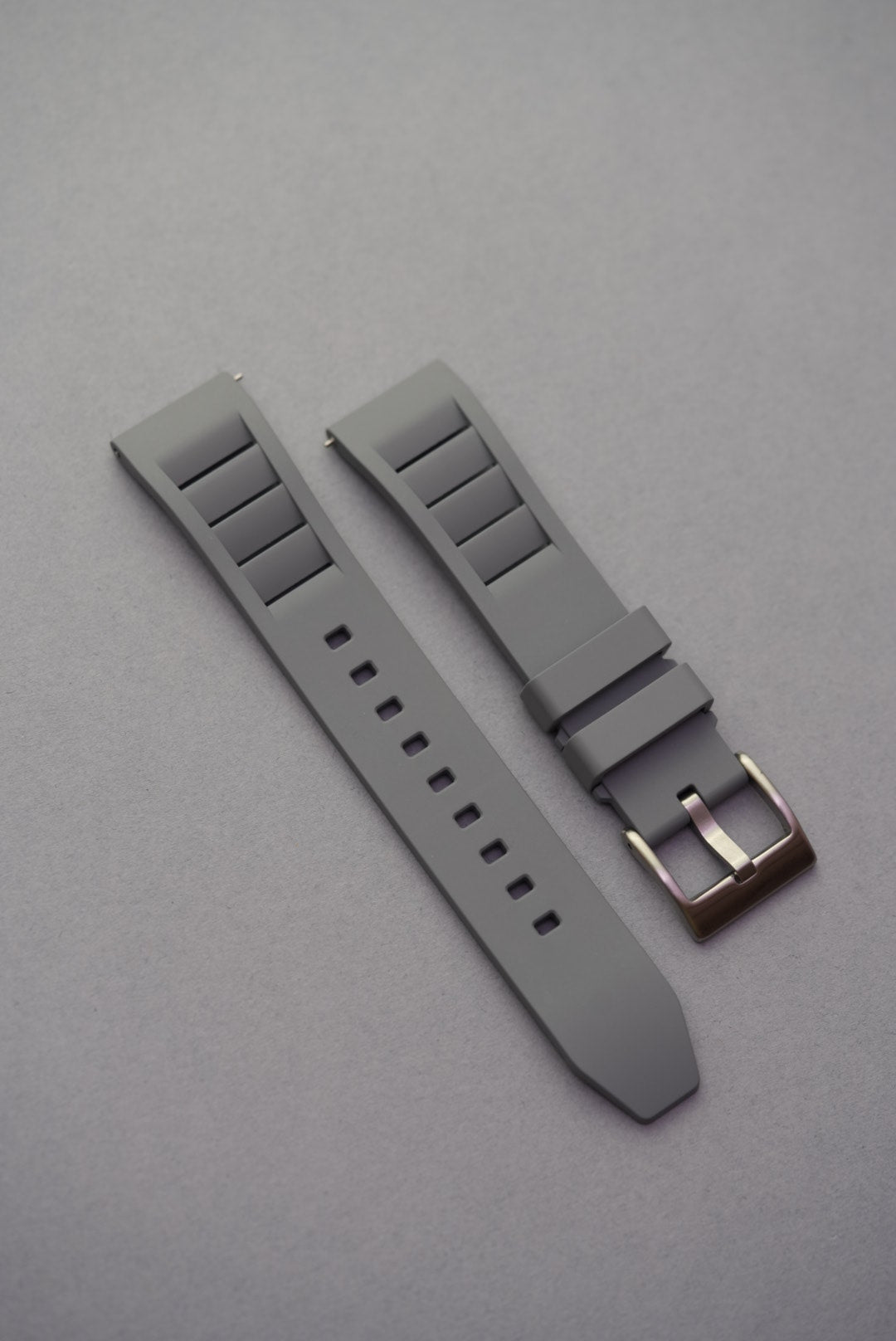 Grey vented FKM rubber strap for watches, offering breathability, flexibility, and everyday comfort.