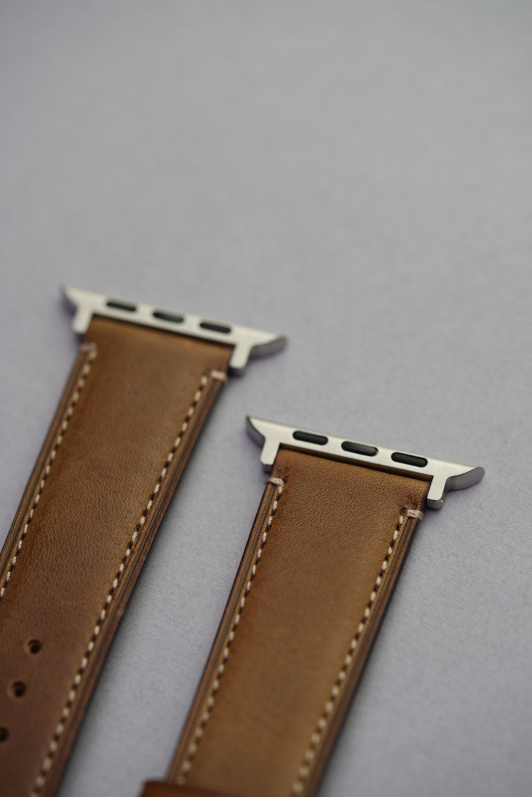 Apple Watch lug connector detail of green fine grain calfskin strap with stitching