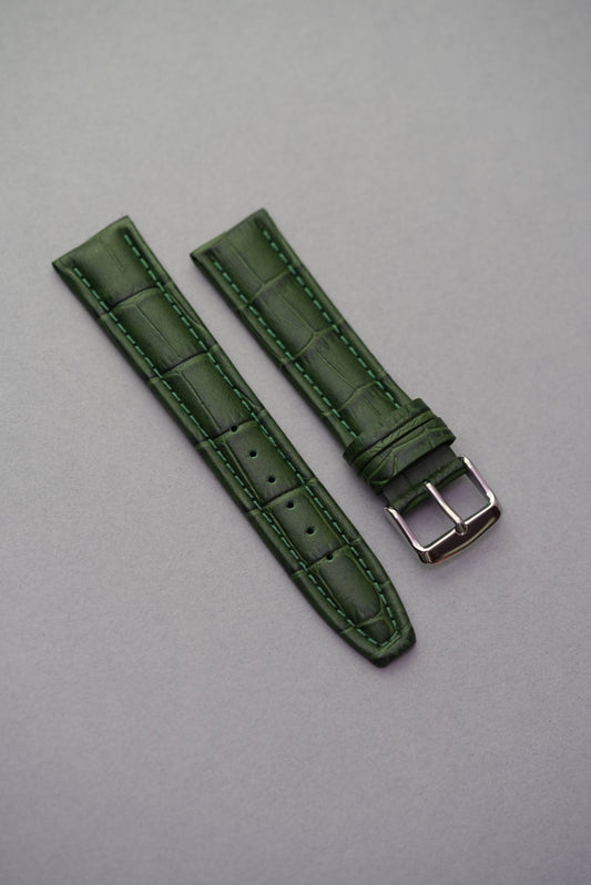 Green calfskin leather strap with embossed alligator pattern and matching green stitching, ideal for classic or dress watches.