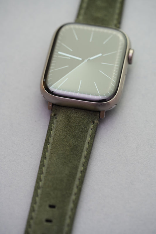 Macro close-up of green suede strap on Apple Watch – soft finish and Apple Watch fitment