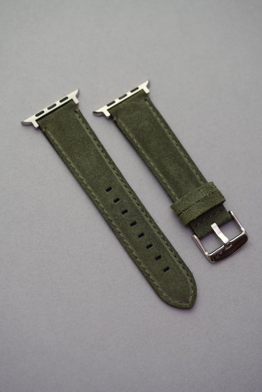 Flat lay of green suede leather Apple Watch strap – fits all Apple Watch generations with stainless adapters
