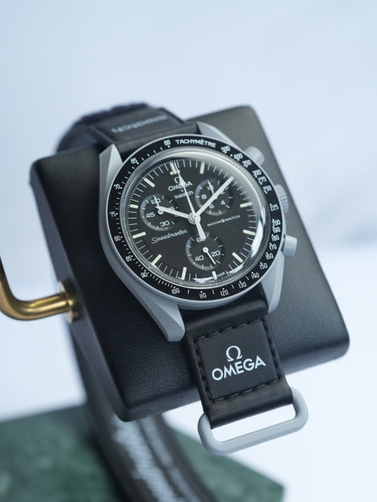 MoonSwatch Mission to the Moon — black dial with white tachymeter and chronograph subdials