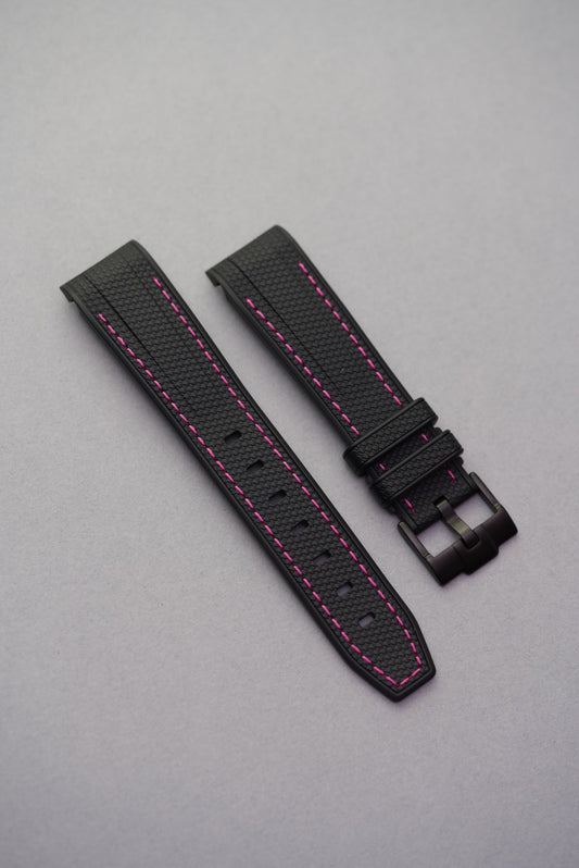 Swatch x Omega MoonSwatch Mission to the Pink Moonphase shown flat with a black rubber strap and vibrant pink stitching – modern and bold aesthetic.