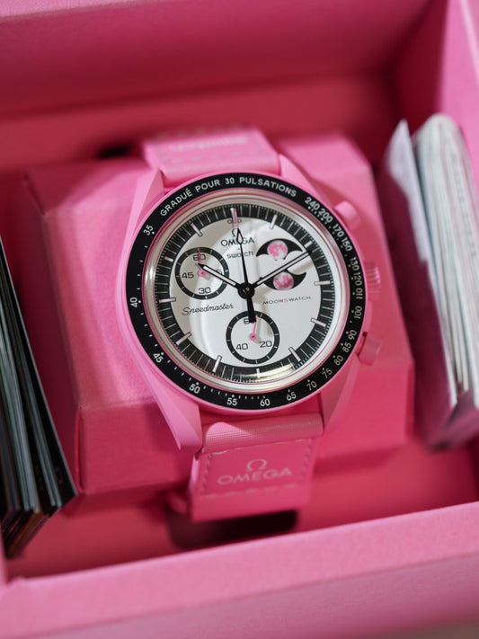 Back view of the pink nylon strap on wrist – durable double-stitched weave ideal for daily wear on the MoonSwatch Pink Moonphase.