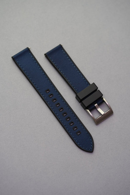 Deep navy sailcloth-style rubber strap with robust construction and matte texture, tailored for Omega x Swatch MoonSwatch wearers.