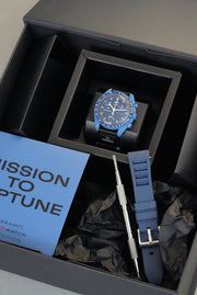 Blue watch with strap and box in a black box