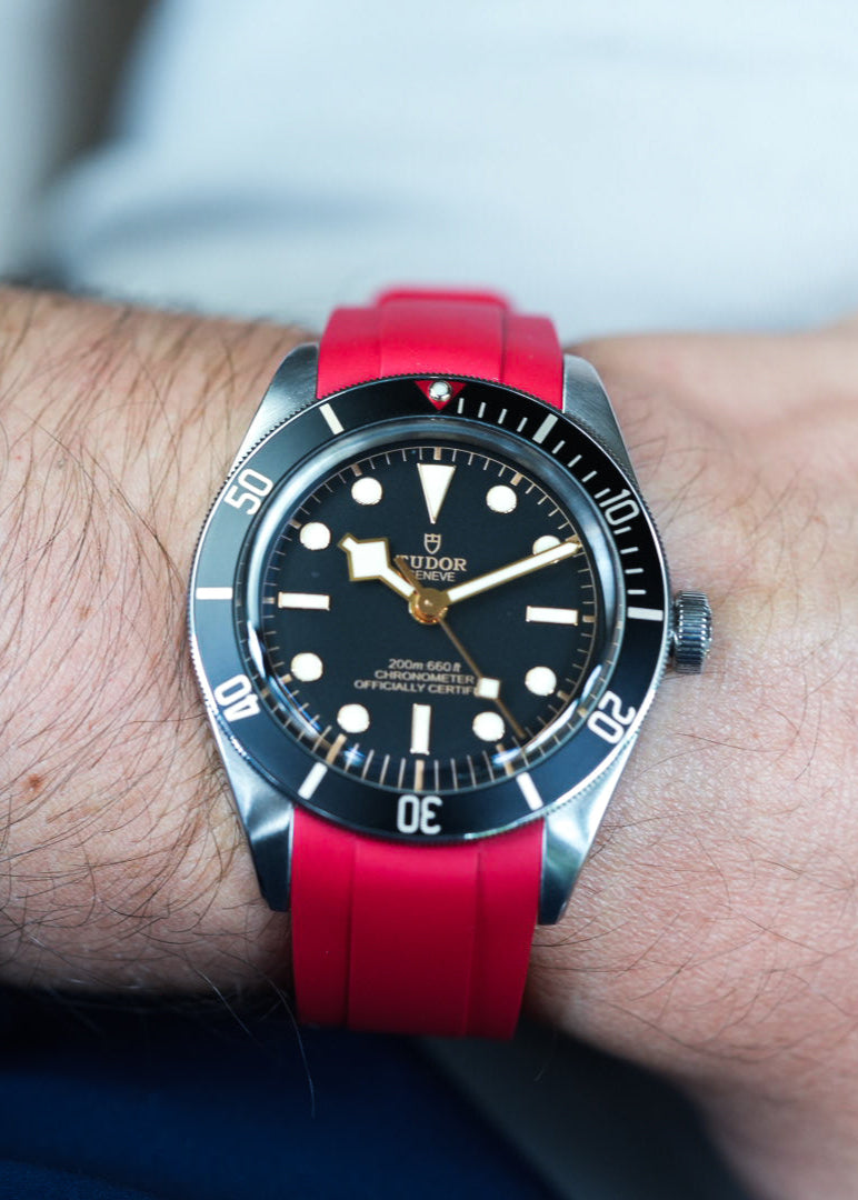 Front view of Tudor Black Bay on red FKM rubber strap – vibrant waterproof upgrade for dive watch enthusiasts.
