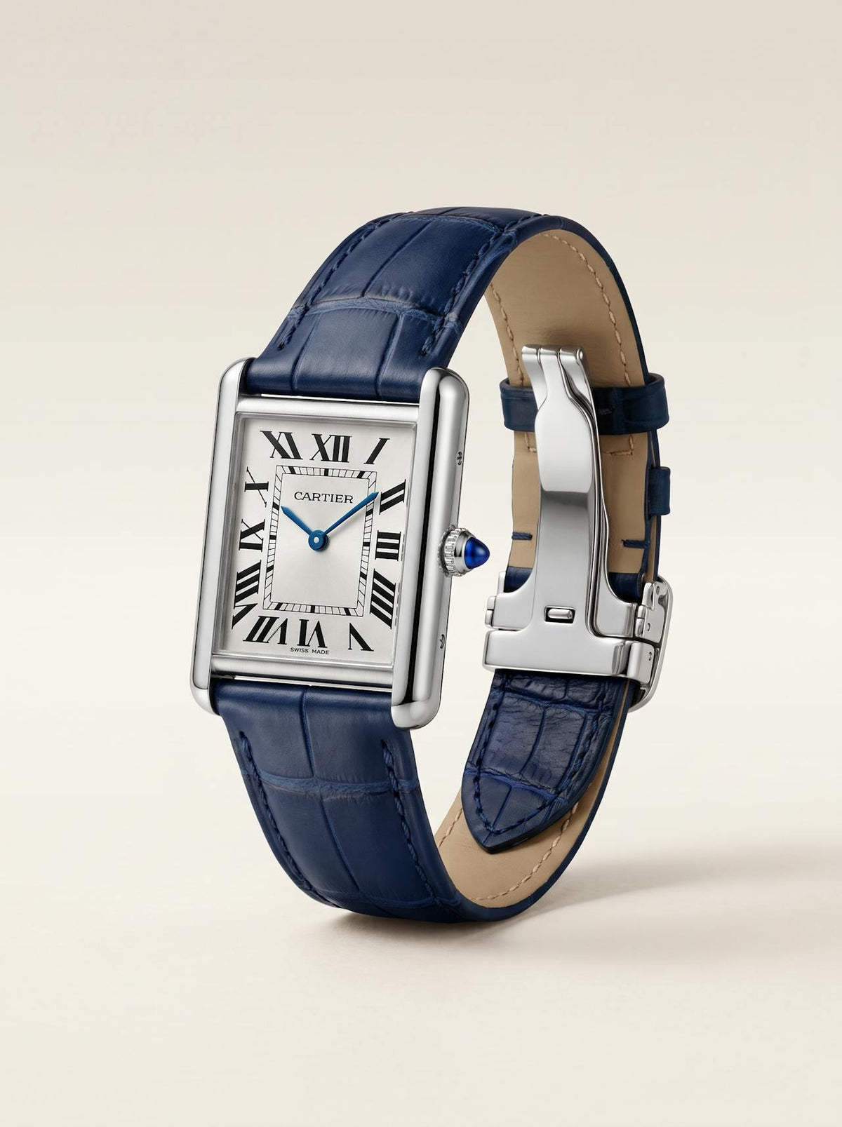 Blue square alligator-grain leather Cartier Tank strap, 16mm, angled view showing beige lining and folding deployant clasp