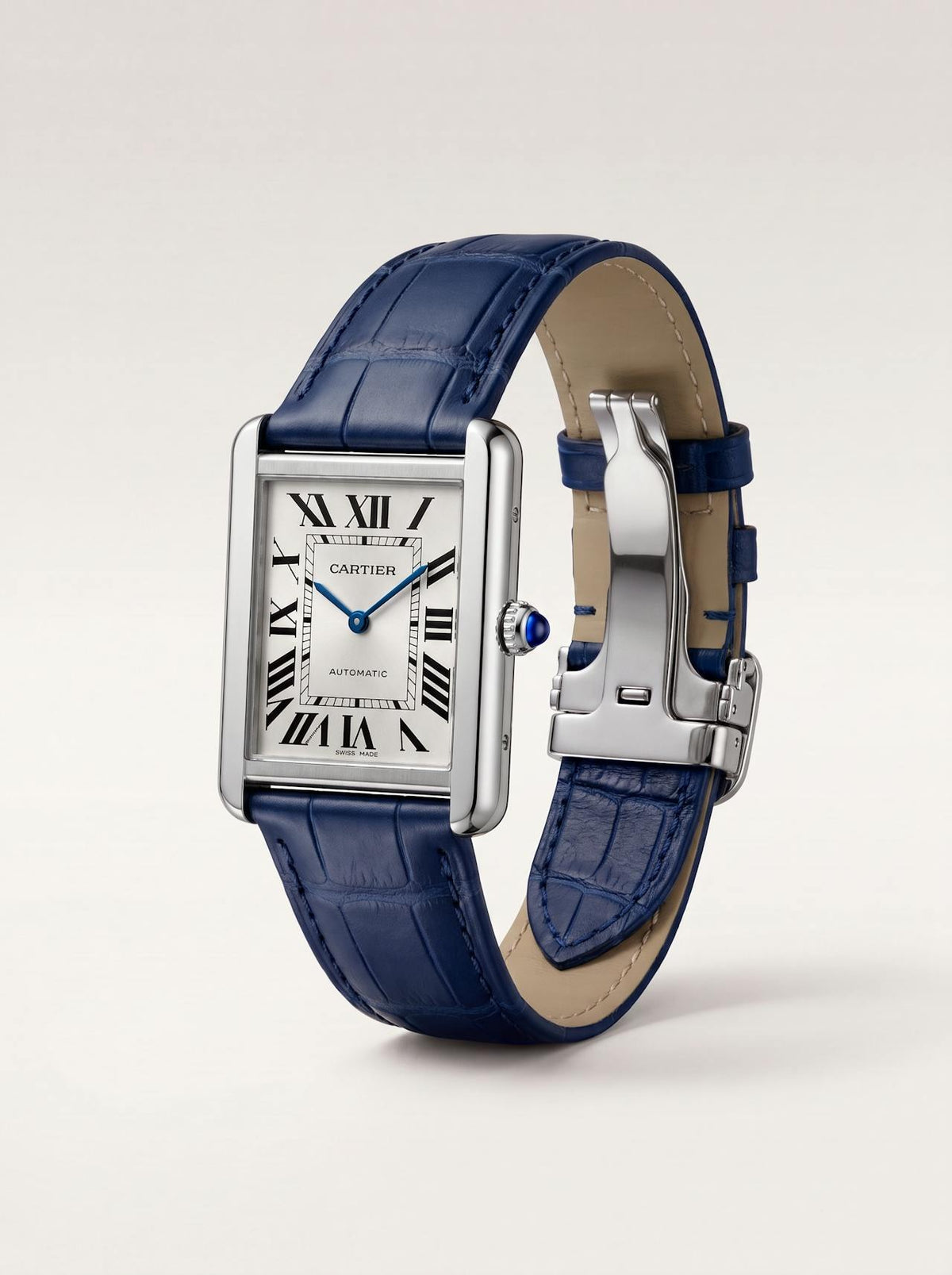 Blue square alligator-grain leather Cartier Tank strap, 20mm, angled view showing beige lining and folding deployant clasp