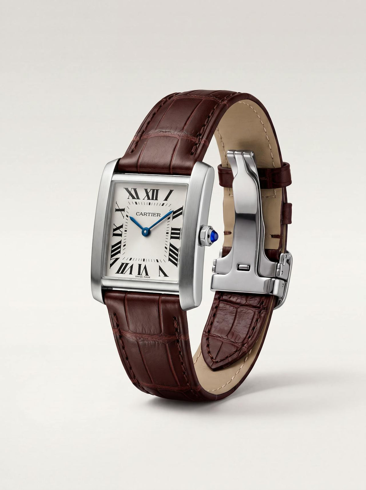 Brown square alligator-grain leather Cartier Tank strap, 18mm, angled view showing beige lining and folding deployant clasp