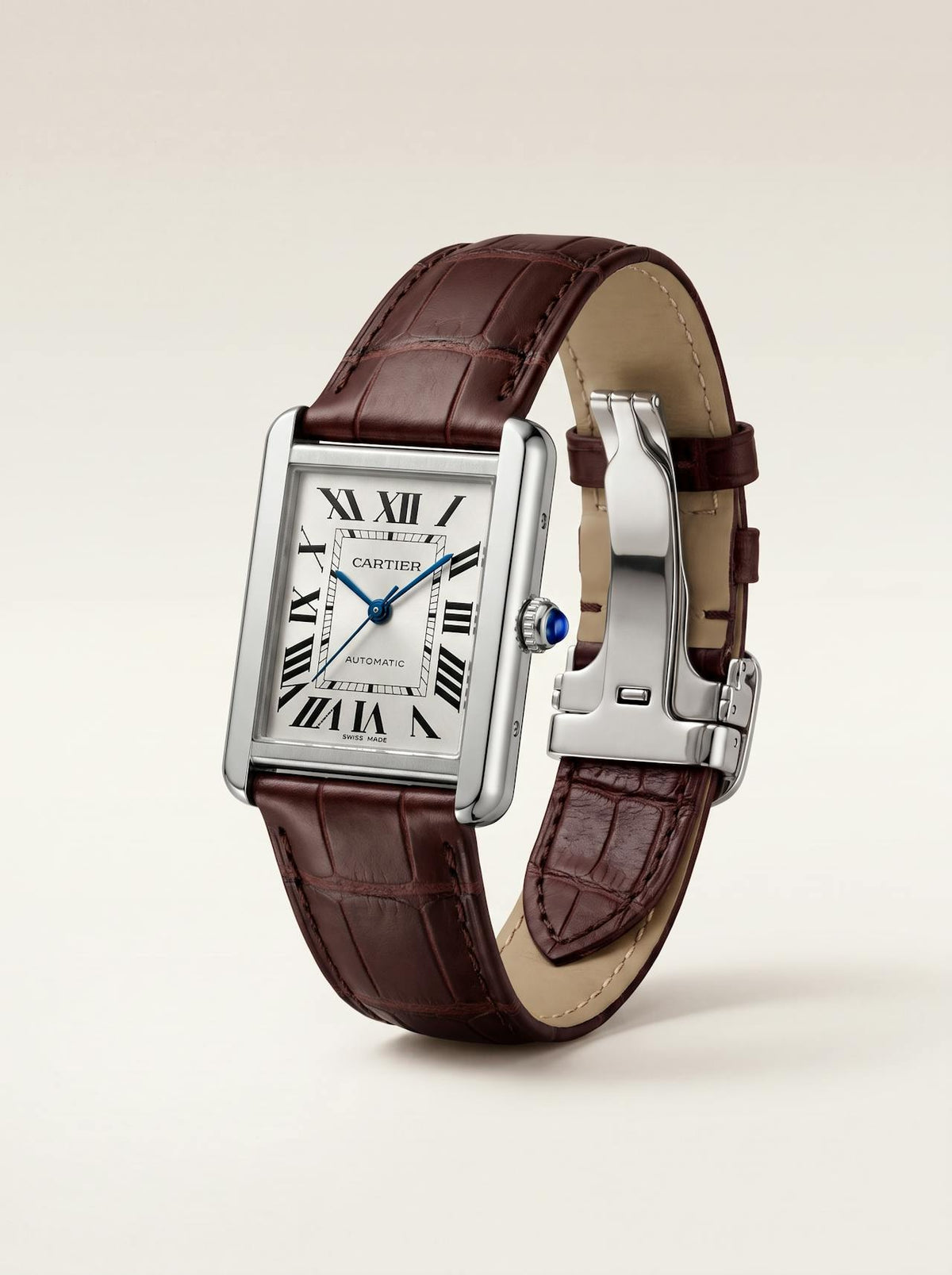 Brown square alligator-grain leather Cartier Tank strap, 20mm, angled view showing beige lining and folding deployant clasp