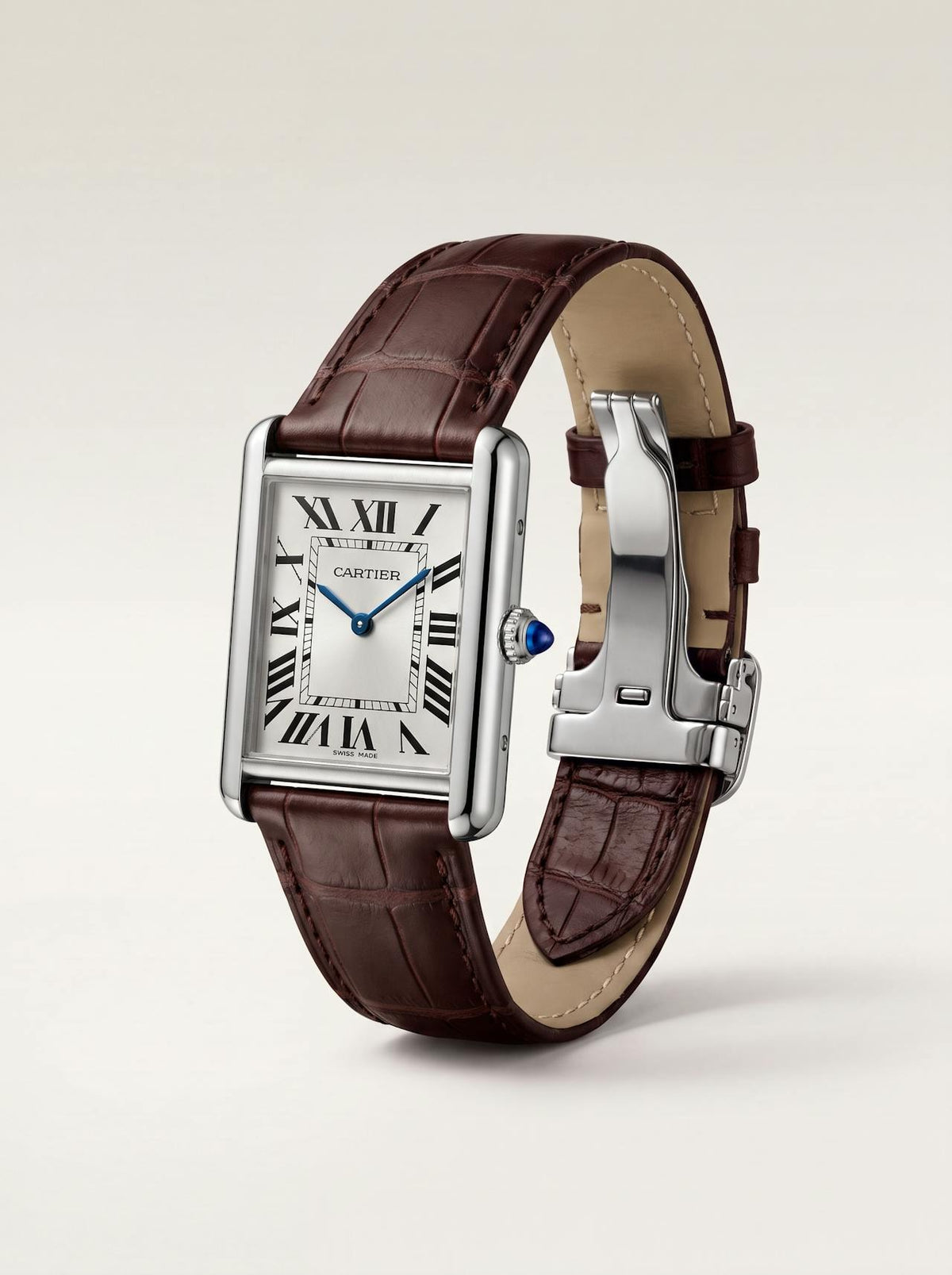 Brown square alligator-grain leather Cartier Tank strap, 23mm, angled view showing beige lining and folding deployant clasp