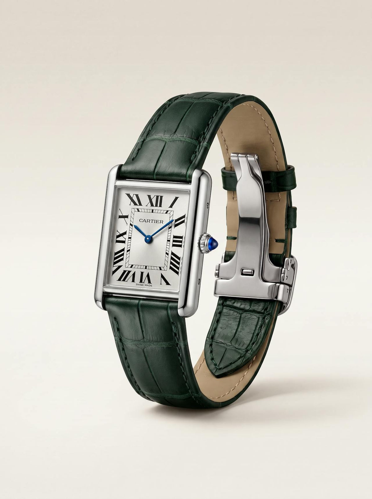 Green square alligator-grain leather Cartier Tank strap, 16mm, angled view showing beige lining and folding deployant clasp