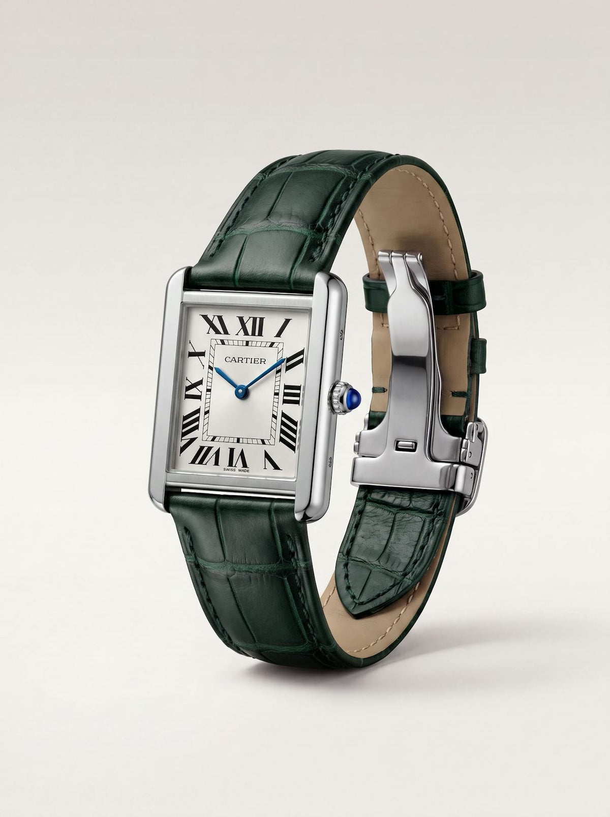Green square alligator-grain leather Cartier Tank strap, 17.5mm, angled view showing beige lining and folding deployant clasp