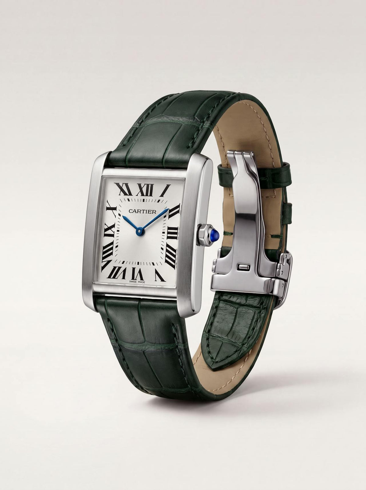 Green square alligator-grain leather Cartier Tank strap, 18mm, angled view showing beige lining and folding deployant clasp
