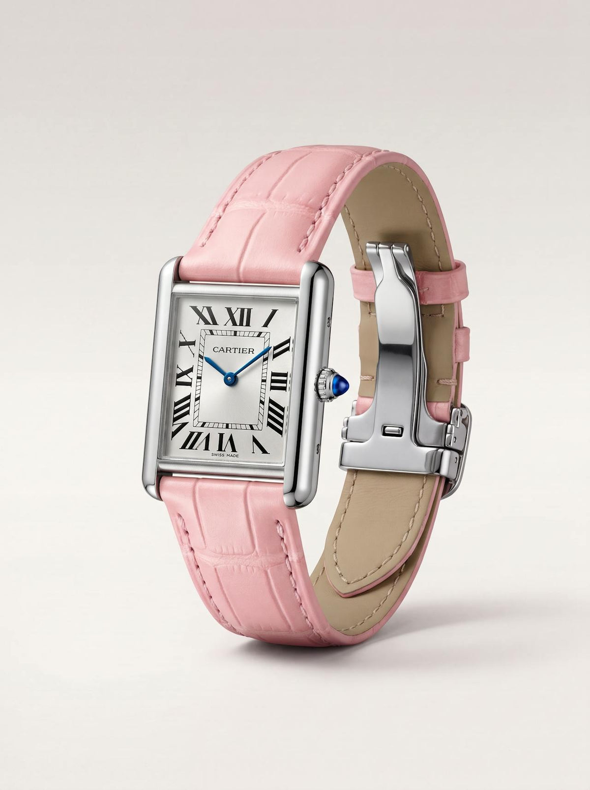 Pink square alligator-grain leather Cartier Tank strap, 16mm, angled view showing beige lining and folding deployant clasp