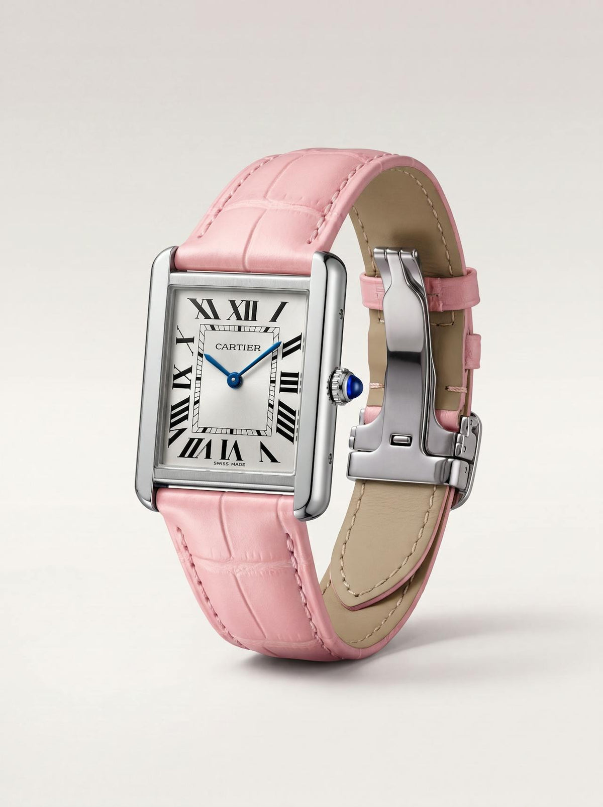 Pink square alligator-grain leather Cartier Tank strap, 17.5mm, angled view showing beige lining and folding deployant clasp