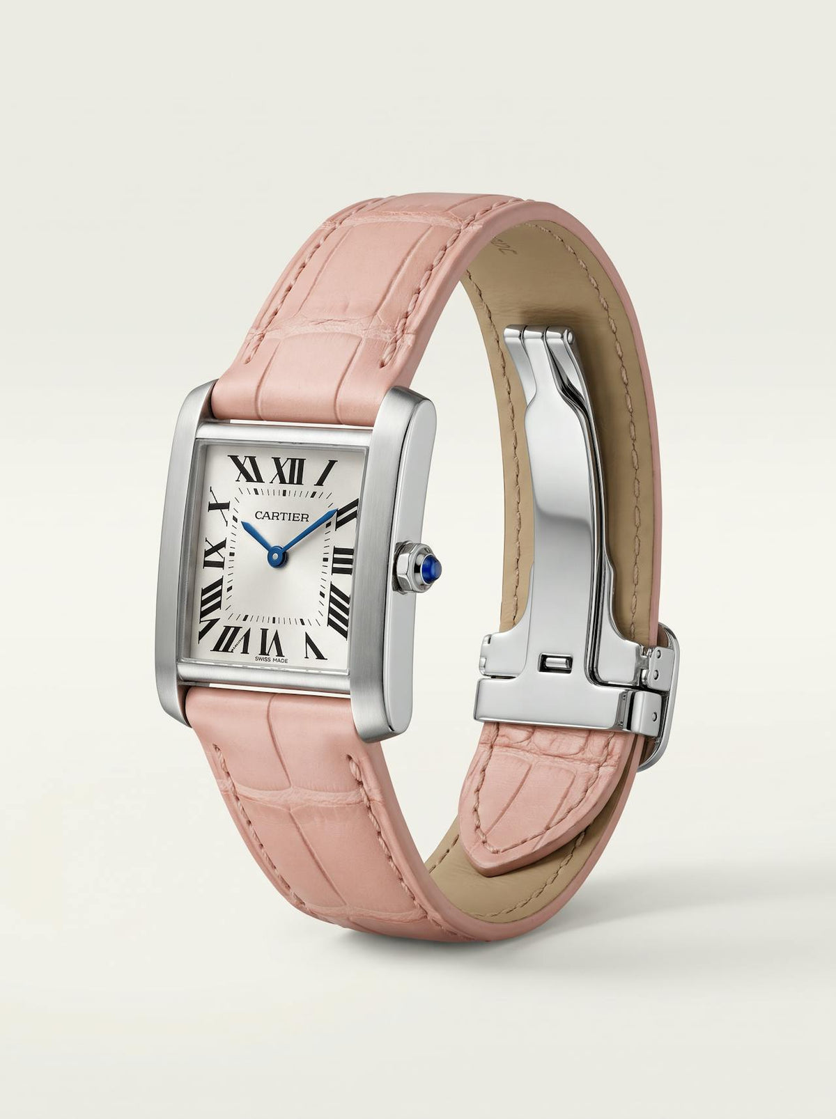 Pink square alligator-grain leather Cartier Tank strap, 18mm, angled view showing beige lining and folding deployant clasp