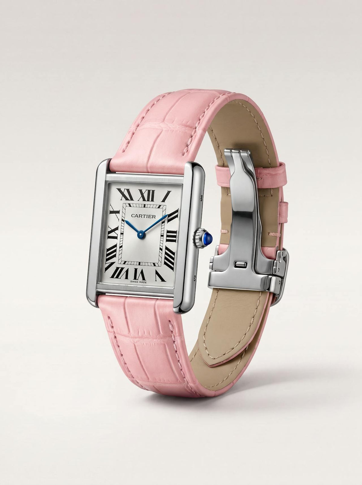 Pink square alligator-grain leather Cartier Tank strap, 20mm, angled view showing beige lining and folding deployant clasp