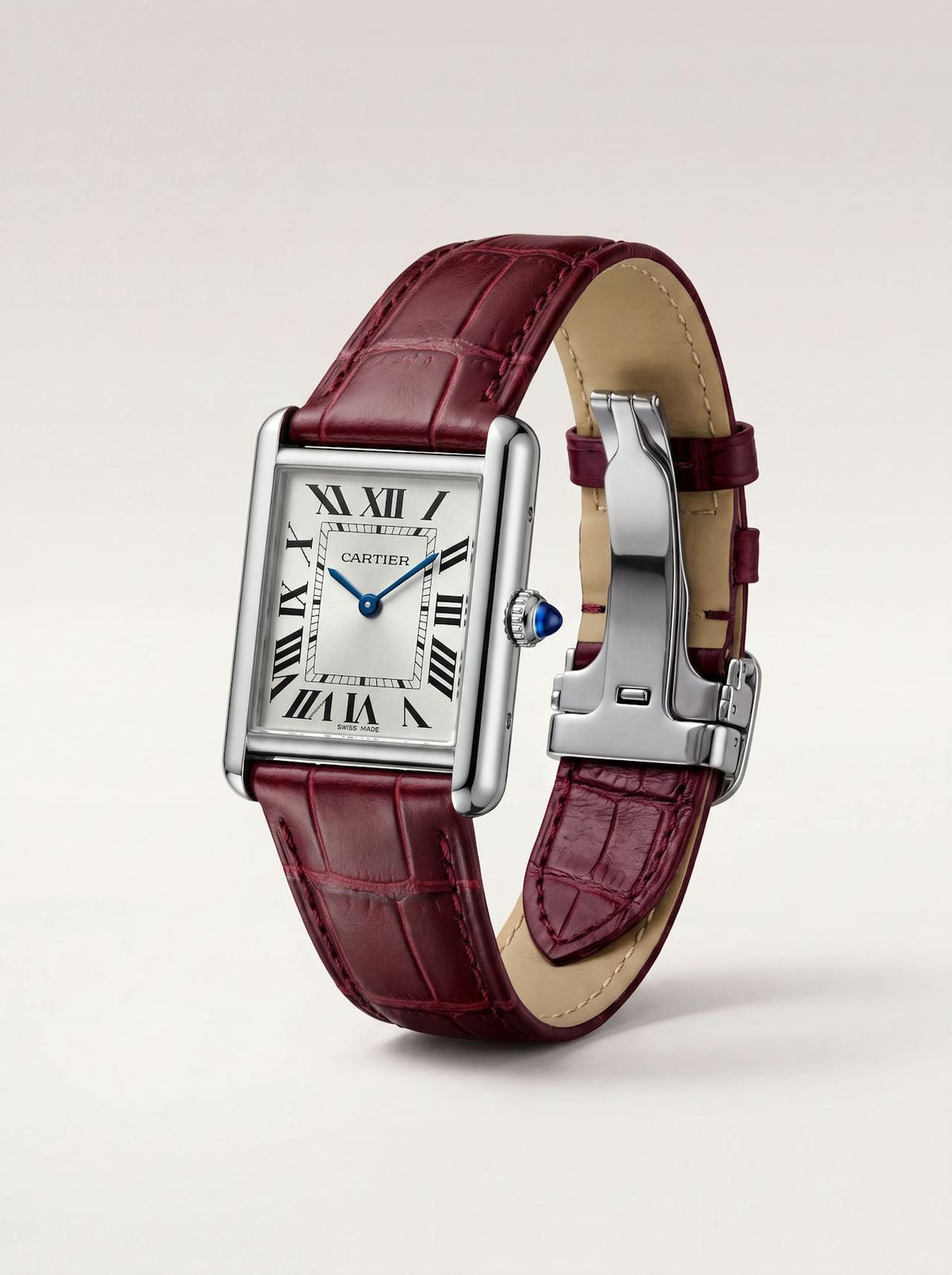 Red square alligator-grain leather Cartier Tank strap, 16mm, angled view showing beige lining and folding deployant clasp