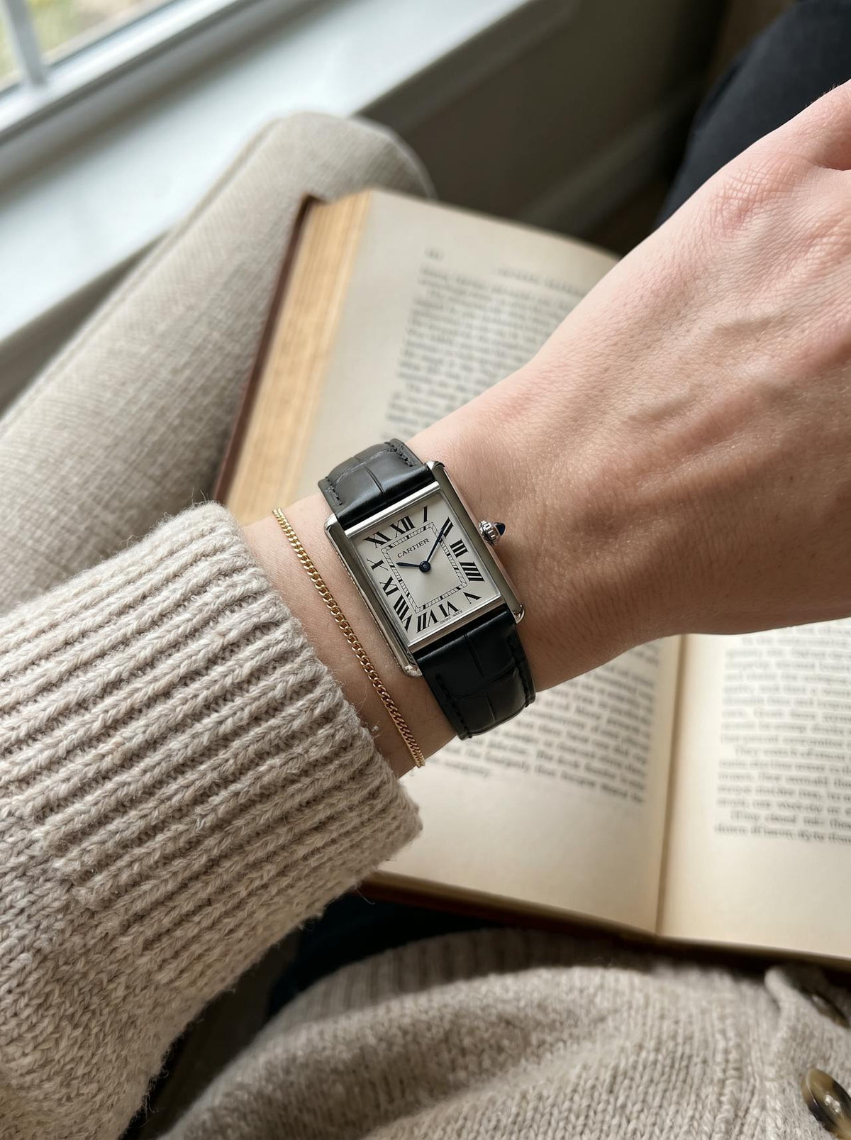 Cartier Tank Must Small on a black square alligator-grain leather strap, worn on the wrist