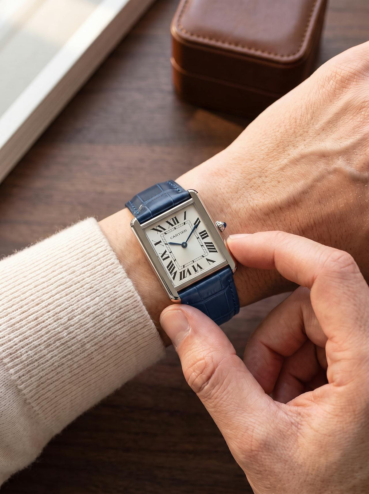 Cartier Tank Solo Large on a blue square alligator-grain leather strap, worn on the wrist