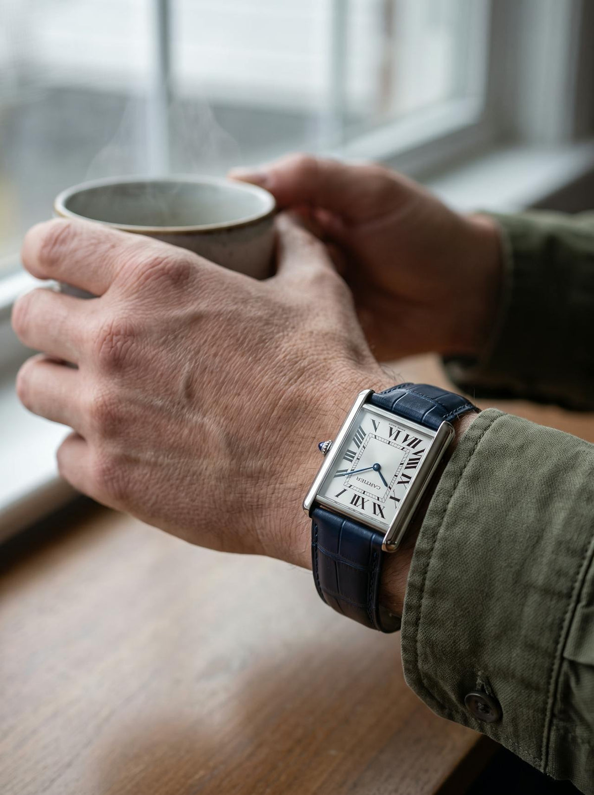 Cartier Tank Must Extra-Large on a blue square alligator-grain leather strap, worn on the wrist