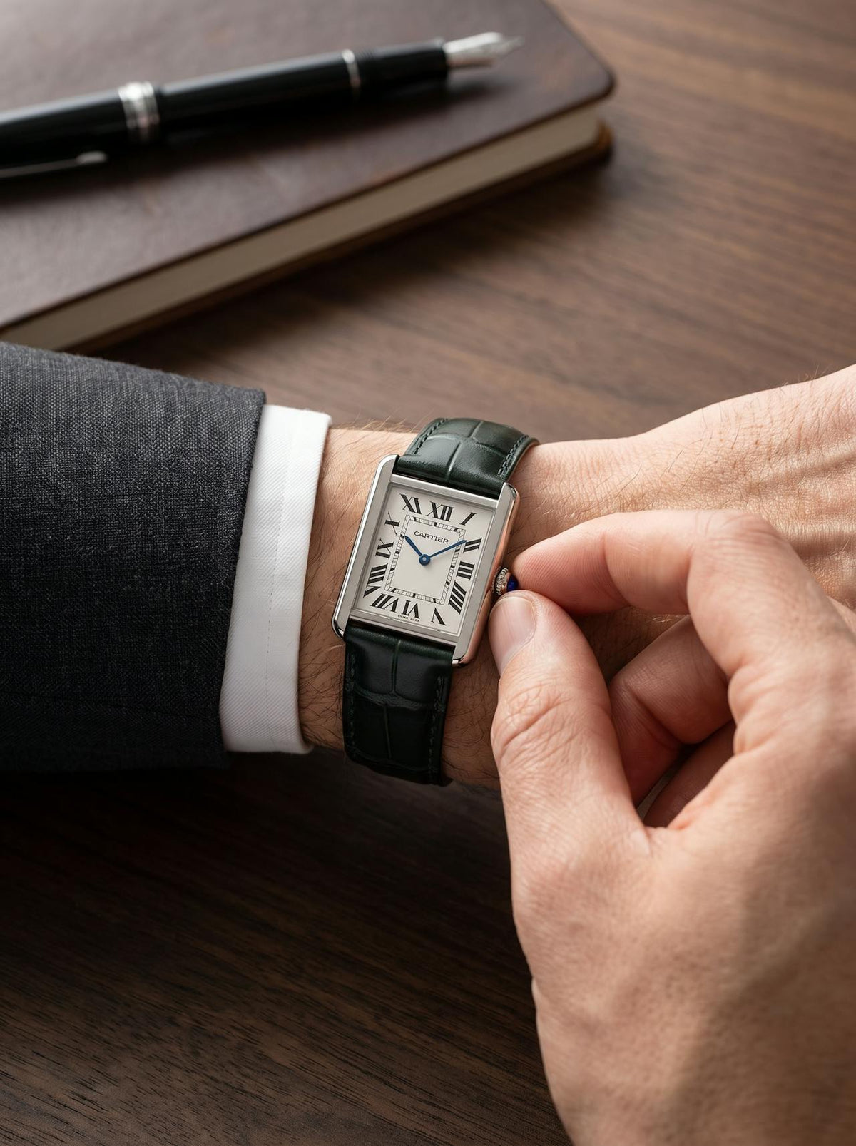 Cartier Tank Solo Large on a green square alligator-grain leather strap, worn on the wrist