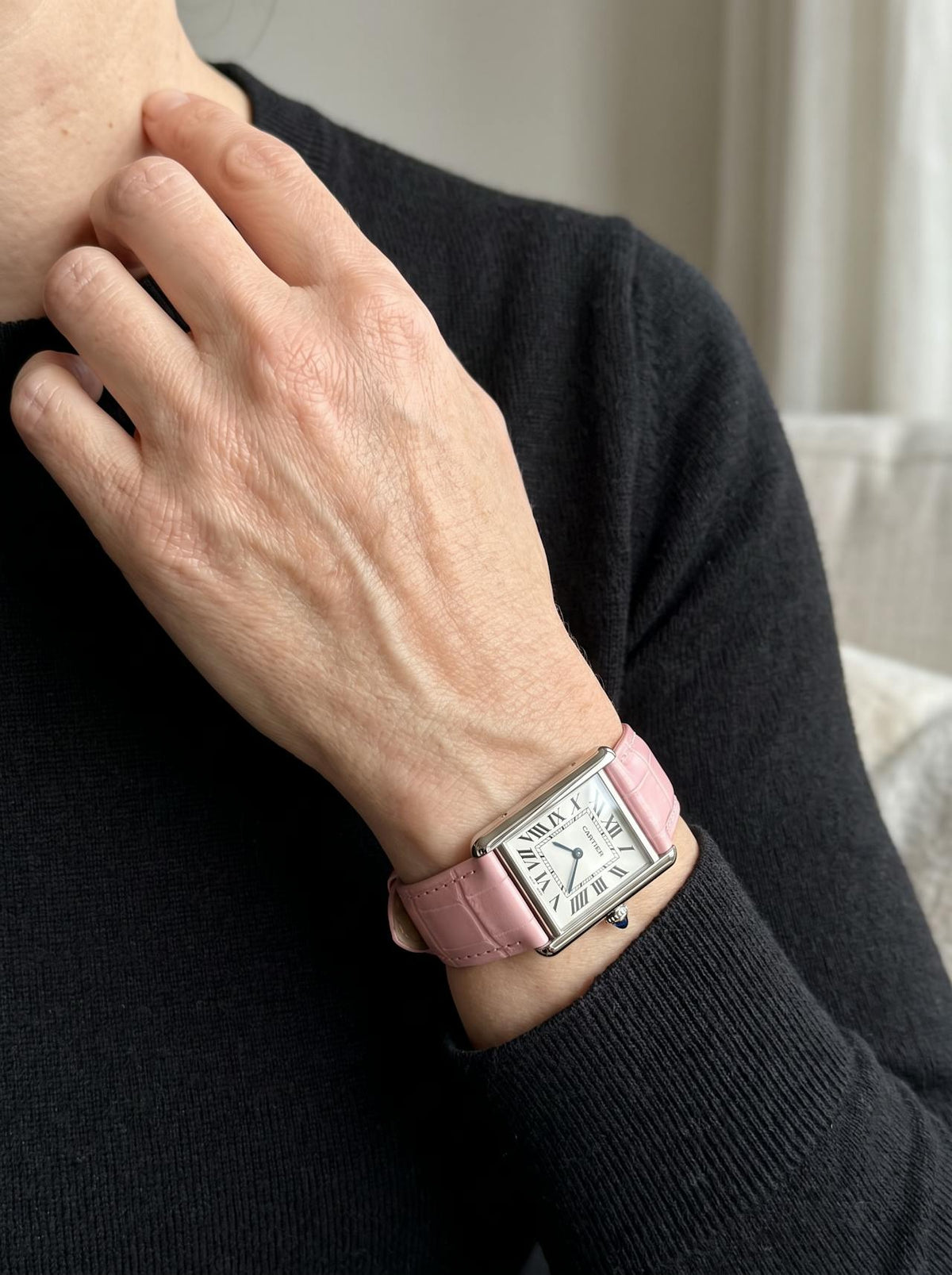 Cartier Tank Must Small on a pink square alligator-grain leather strap, worn on the wrist