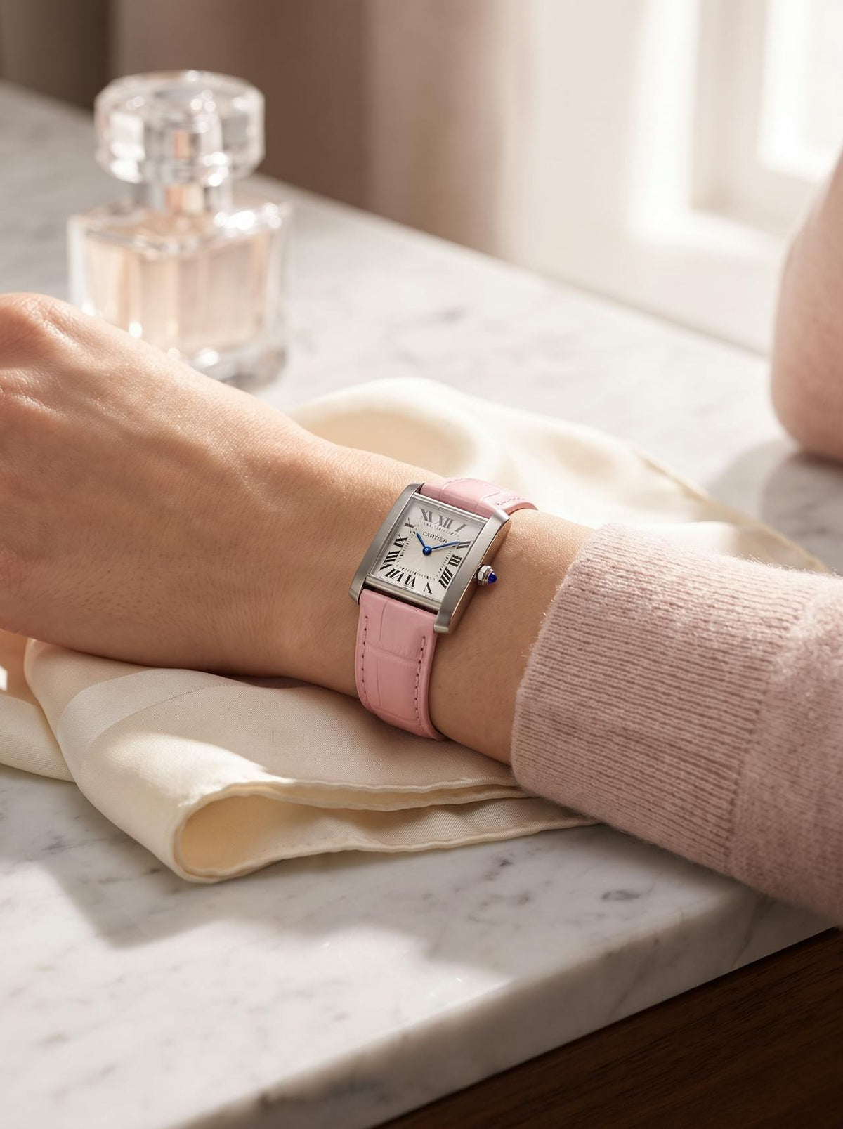 Cartier Tank Française on a pink square alligator-grain leather strap, worn on the wrist