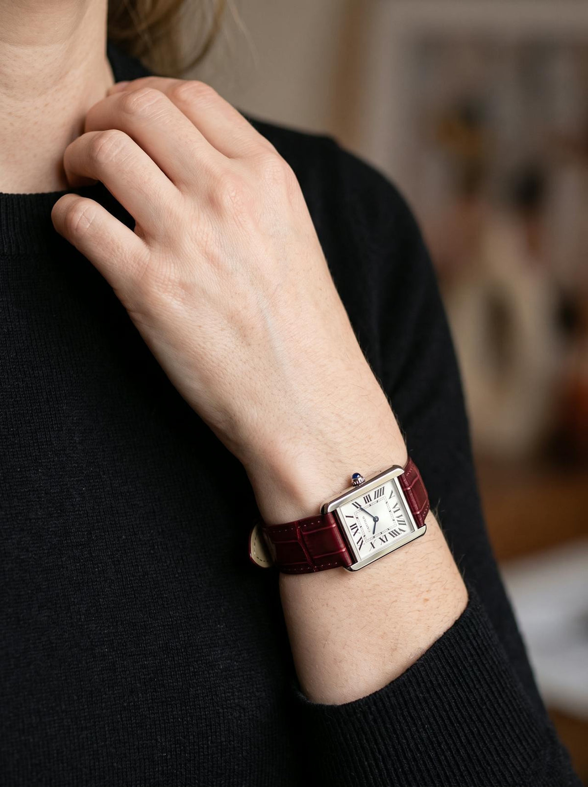 Cartier Tank Solo Small on a red square alligator-grain leather strap, worn on the wrist