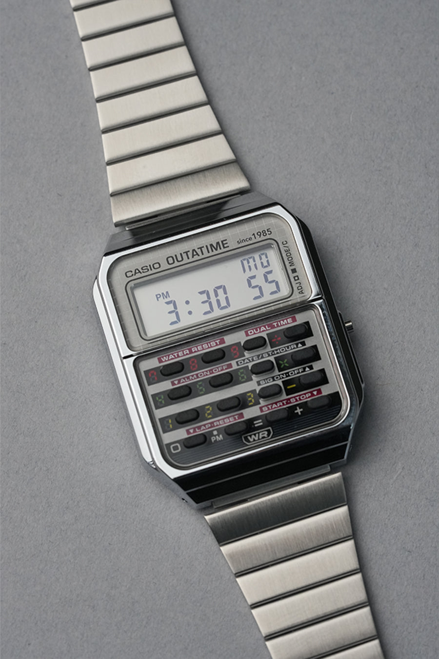 Back to the future Casio digital watch with metallic band on a gray background