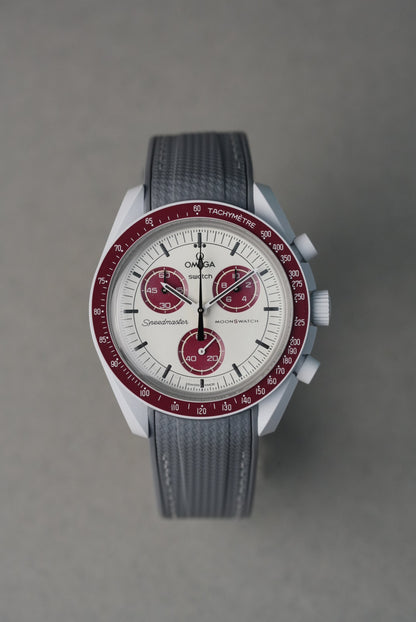 Grey rubber strap with white contrast stitching, made to complement the Swatch x OMEGA MoonSwatch Mission to the Moon.