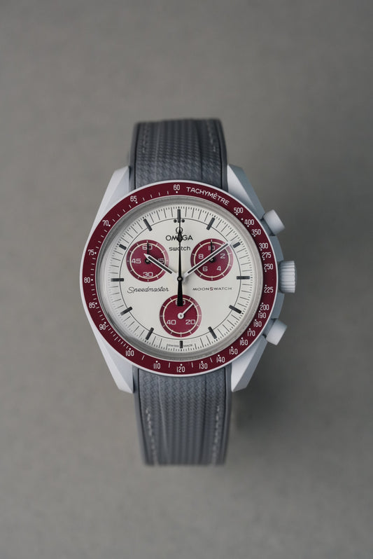 Grey rubber strap with white contrast stitching, made to complement the Swatch x OMEGA MoonSwatch Mission to the Moon.