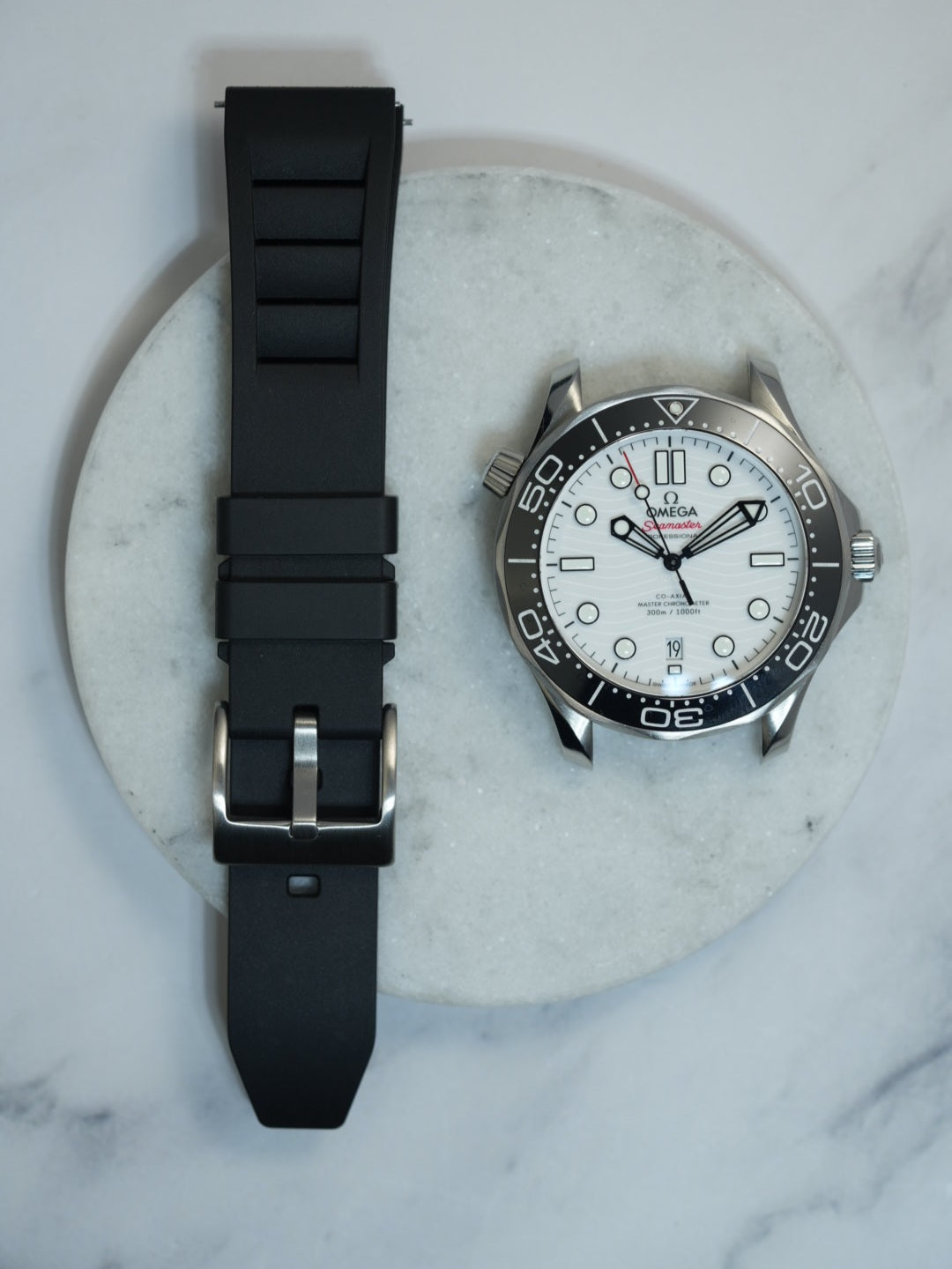 Black FKM rubber watch strap with a vented design and stainless steel buckle, offering durability and a sleek, sporty look. Ideal for dive watches and luxury timepieces.
