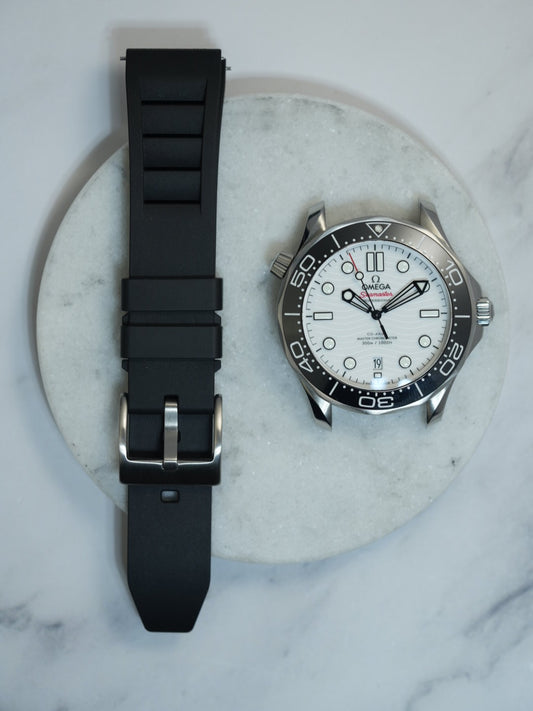 Black FKM rubber watch strap with a vented design and stainless steel buckle, offering durability and a sleek, sporty look. Ideal for dive watches and luxury timepieces.