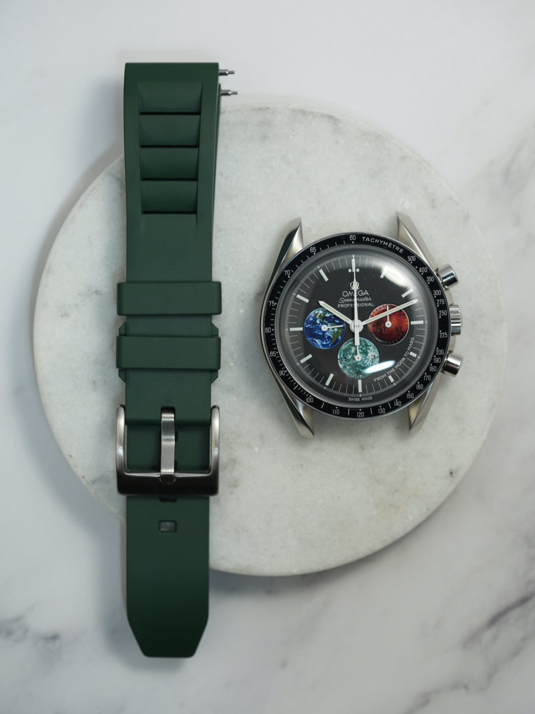 Dark green FKM rubber watch strap with a vented design and stainless steel buckle, offering a durable and breathable fit for all watch types.