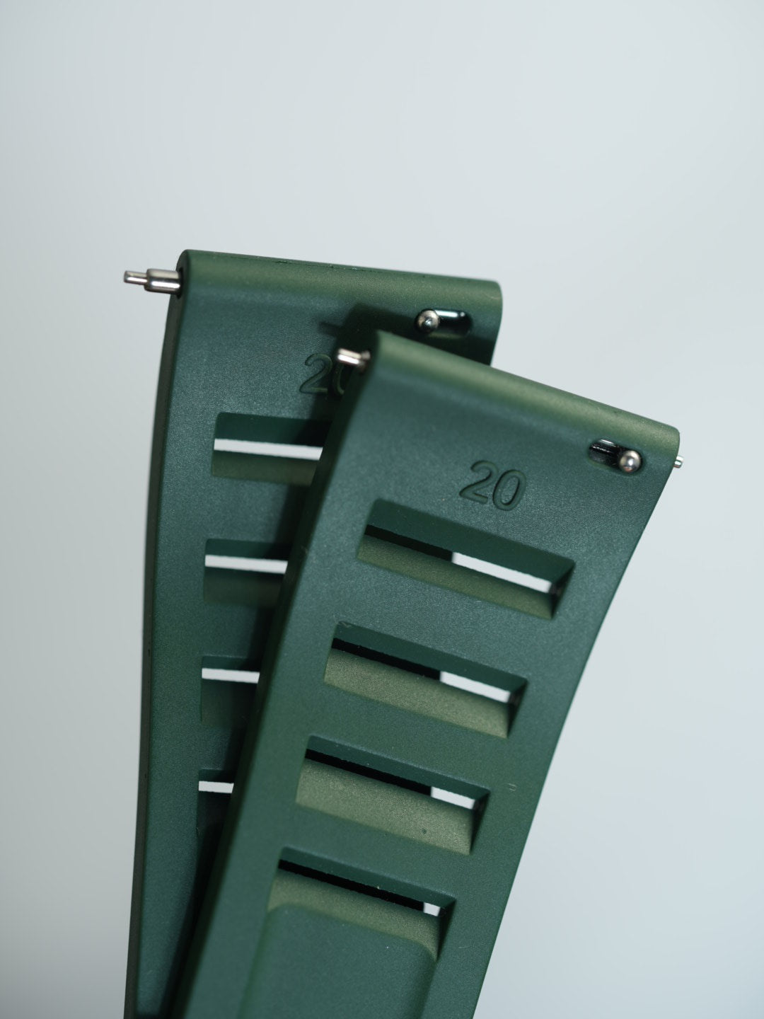 Detailed view of the green vented FKM rubber strap with quick-release spring bars, ensuring a secure and easy fit for a range of watches