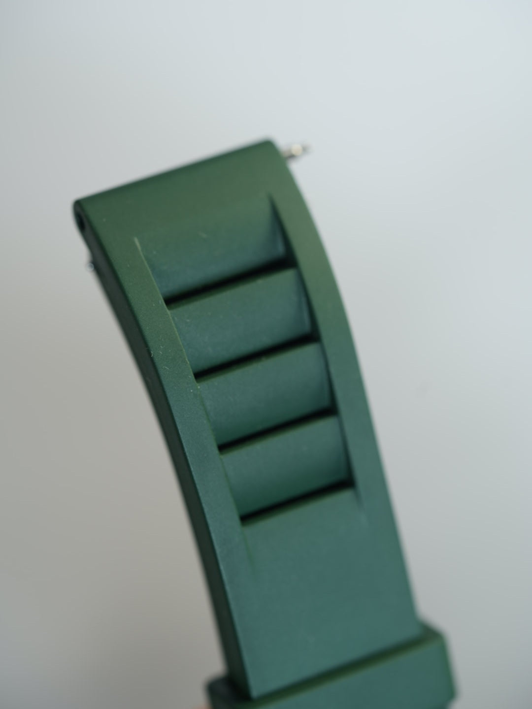 Close-up of the green FKM rubber watch strap showcasing its flexible, waterproof, and breathable design, perfect for active wear
