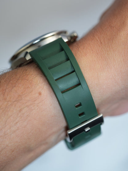 Dark green FKM rubber watch strap on wrist, providing a comfortable and stylish option for Omega and luxury watch enthusiasts