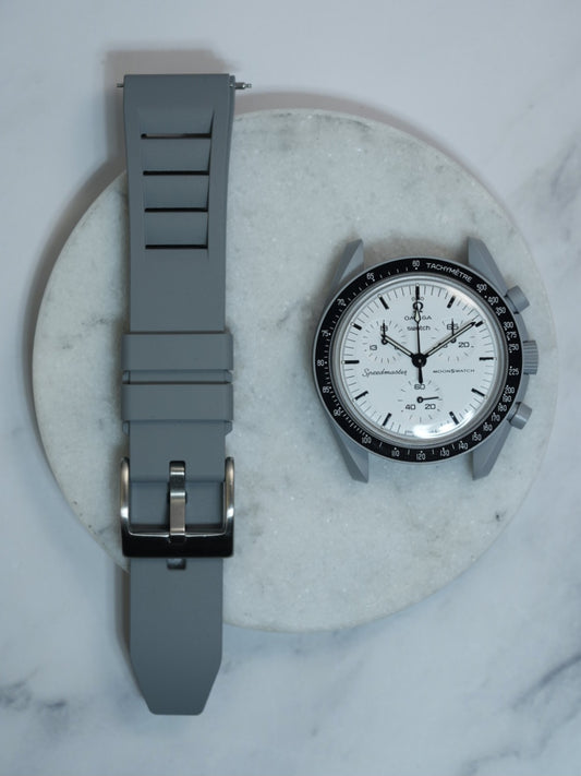 Grey FKM rubber watch strap with a vented design and stainless steel buckle, offering durability and a modern aesthetic. Compatible with MoonSwatch and traditional watches