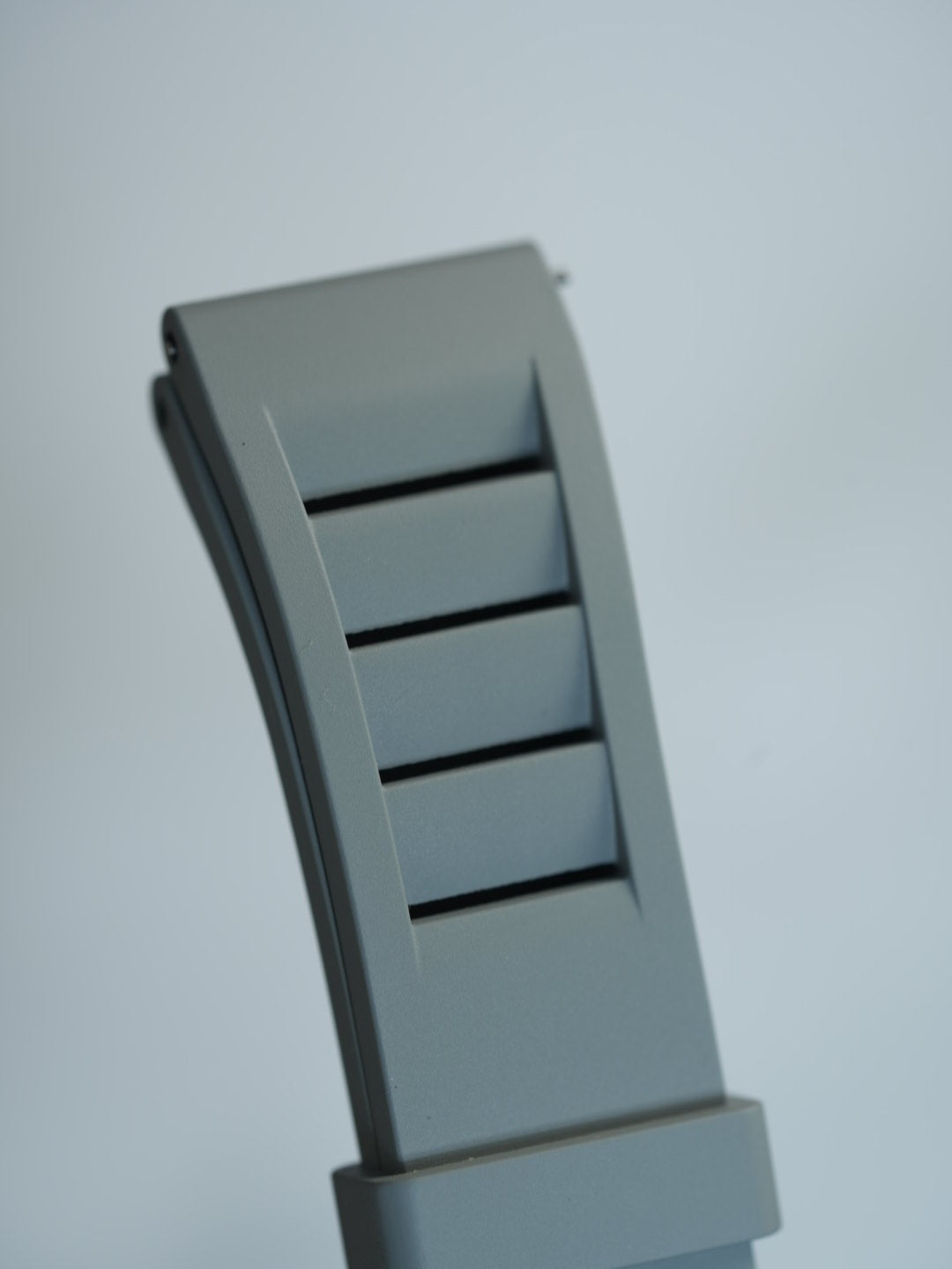 Detailed view of the grey FKM rubber strap’s vented design and engraved 20mm size marking, ideal for MoonSwatch enthusiasts