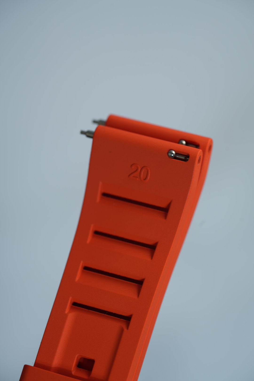 FKM rubber strap in vibrant orange with quick-release spring bars, ideal for easy installation on smartwatches and traditional watches