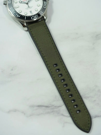 Close-up of the 13 adjustment holes on the FKM rubber strap, highlighting its durability and flexibility for various wrist sizes.